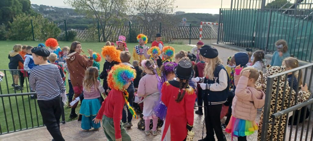 Children dressed in colorful Carnival costumes, smiling and enjoying the festive atmosphere